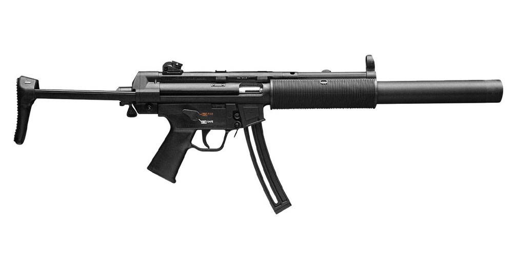 Side view of an h&k mp5 submachine gun with a retracted stock and suppressor.
