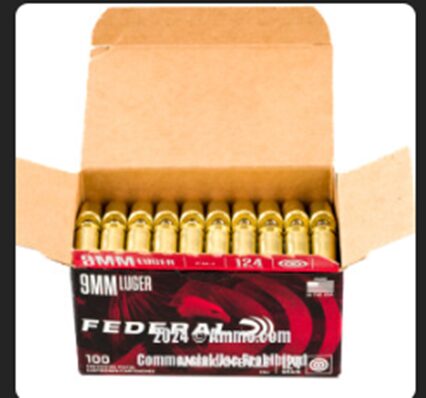 A box of 9mm luger ammunition cartridges partially open, displaying rows of bullets.